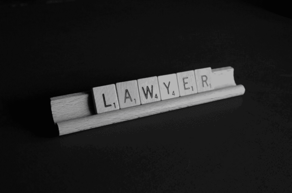 The word "Lawyer" written in white tiles against a dark